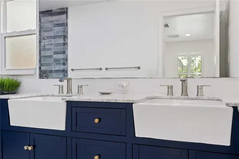 a utility room with cabinets washer and dryer
