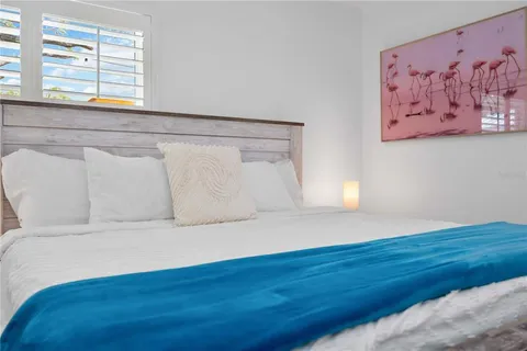 a view of a room with wooden floor and a window