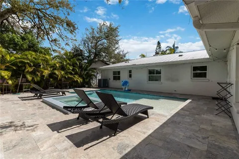 a view of a lounge chairs in the patio