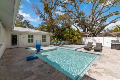 a view of a backyard with a patio