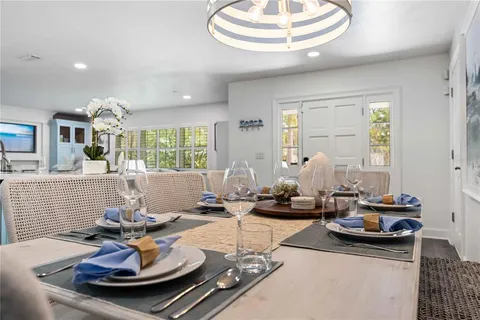 a living room with fireplace furniture and a large window