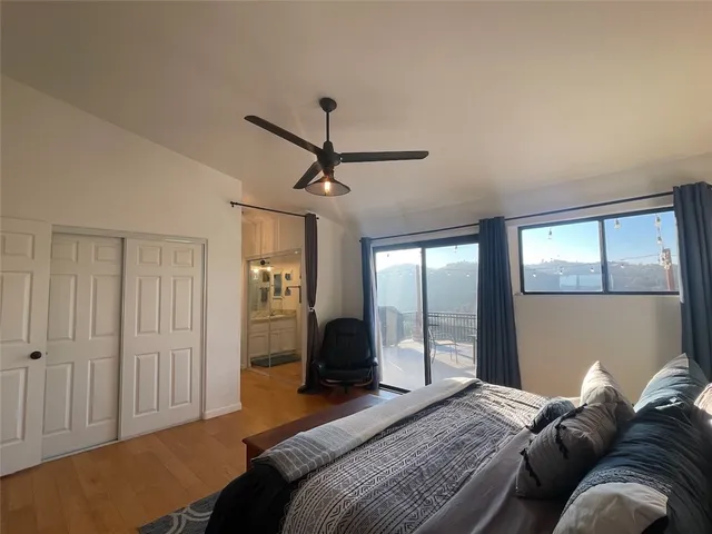 a en suite bathroom with a granite countertop sink and a mirror