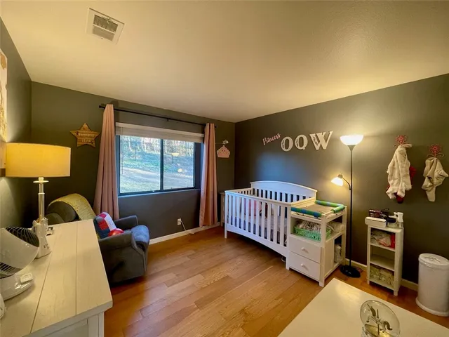 a bathroom with a sink a toilet and shower curtain