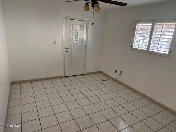a view of an empty room and window in a room
