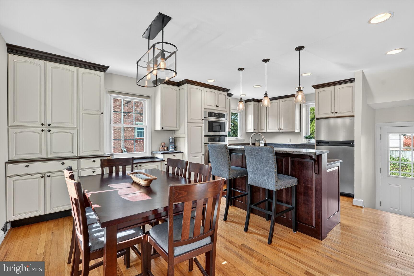 10406 Ewell Avenue Kensington, MD 20895 - Photo 16 of 42 a view of a dining room with furniture window and wooden floor