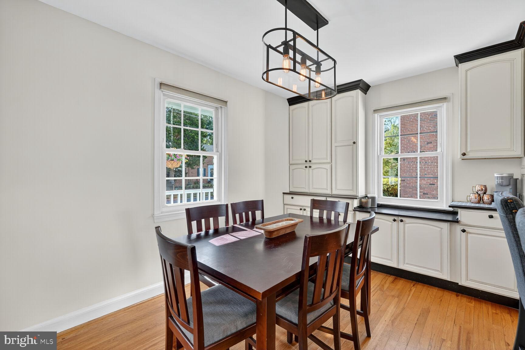 10406 Ewell Avenue Kensington, MD 20895 - Photo 17 of 42 a kitchen that has a table and chairs in it