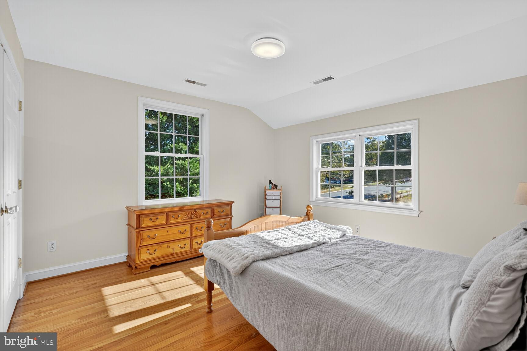 10406 Ewell Avenue Kensington, MD 20895 - Photo 34 of 42 a bedroom with a bed and a window