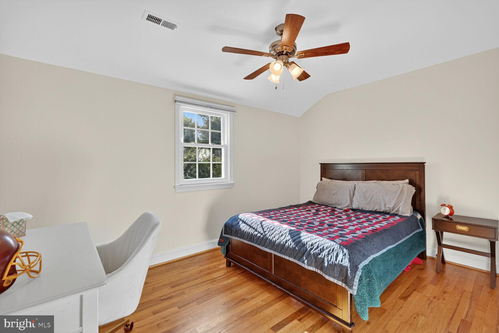 10406 Ewell Avenue Kensington, MD 20895 - Photo 36 of 42 a bedroom with a bed and window