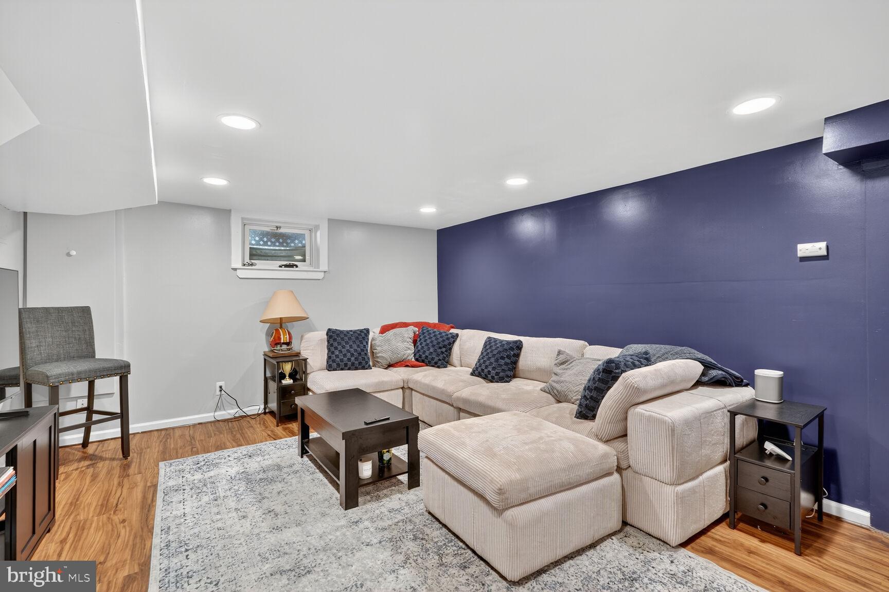 10406 Ewell Avenue Kensington, MD 20895 - Photo 42 of 42 a living room with furniture and a wooden floor
