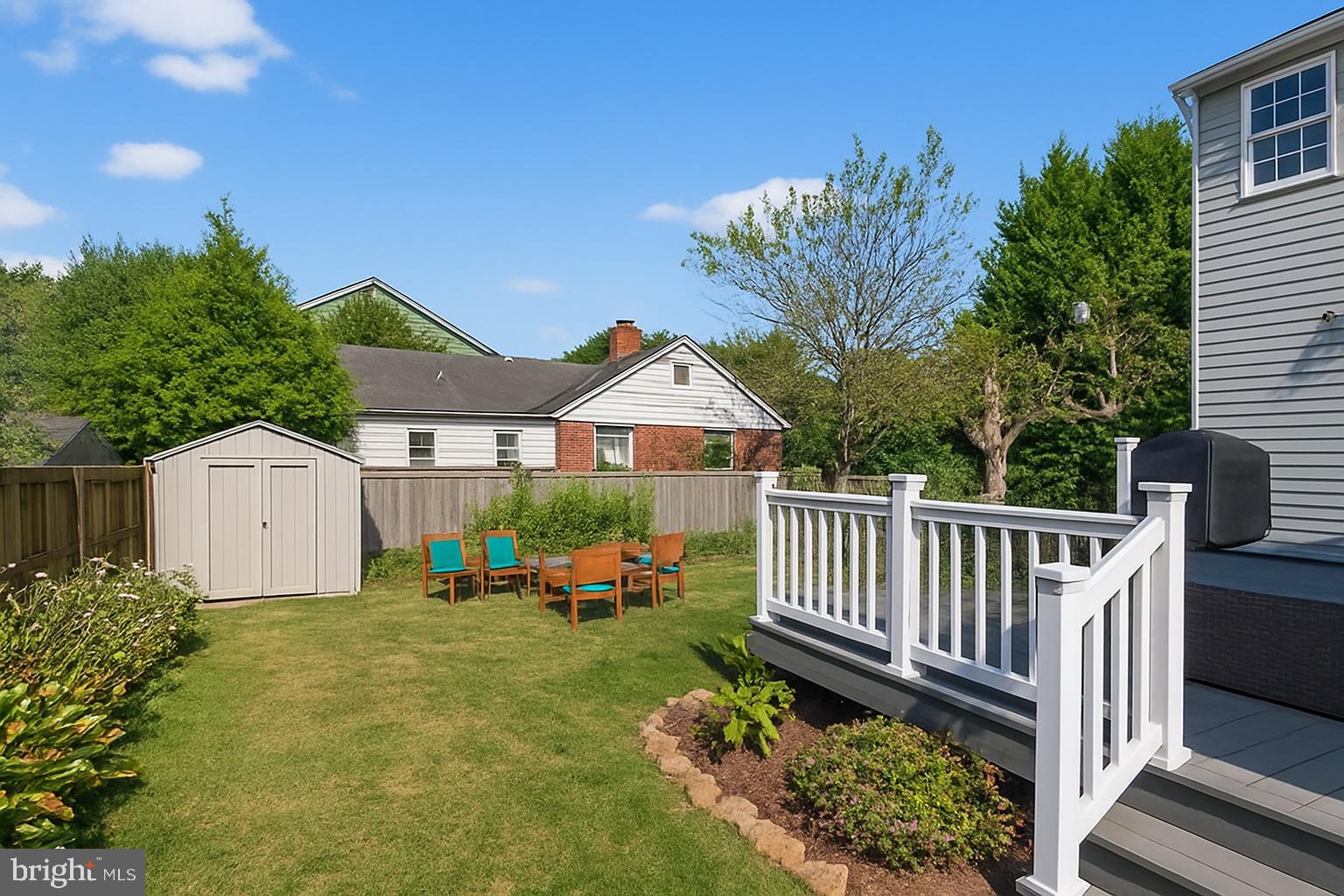 10406 Ewell Avenue Kensington, MD 20895 - Photo 6 of 42 a view of a house with wooden fence next to a yard