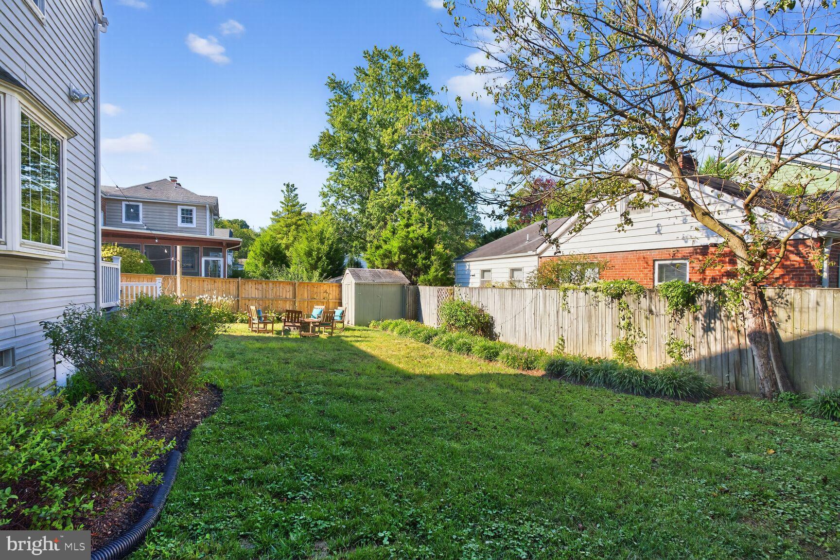 10406 Ewell Avenue Kensington, MD 20895 - Photo 8 of 42 a view of a house with a yard and a garden
