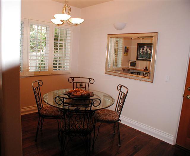 71 Olive Mill Road Montecito, CA 93108 - Photo 6 of 12 a view of a dining room with furniture wooden floor and a chandelier