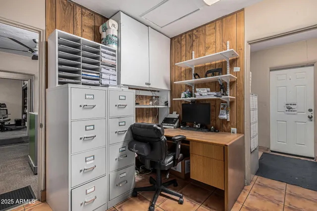 a view of a workspace with furniture
