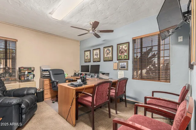 a view of a livingroom with furniture and a window