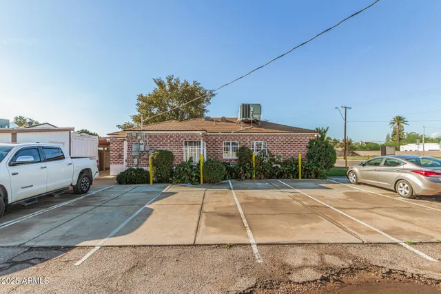 a view of a car park in front of a house