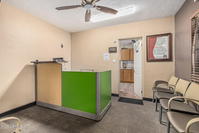 a view of a room with workspace and a window