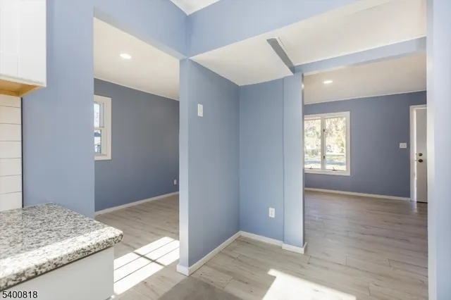 a bedroom with granite countertop and sink