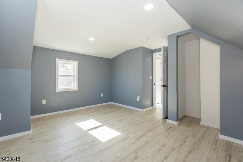 1 Pine Court Little Falls, NJ 07424 - Photo 17 of 24 an empty room with wooden floor and windows