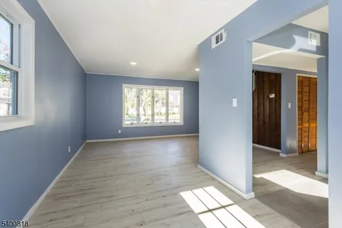 a view of an empty room and window