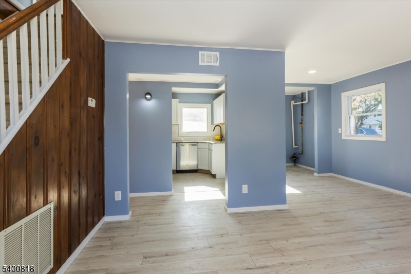 1 Pine Court Little Falls, NJ 07424 - Photo 6 of 24 a view interior of a house with wooden floor and windows