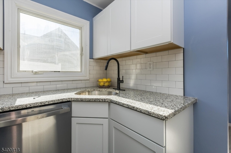1 Pine Court Little Falls, NJ 07424 - Photo 10 of 24 a kitchen with granite countertop a sink and a window