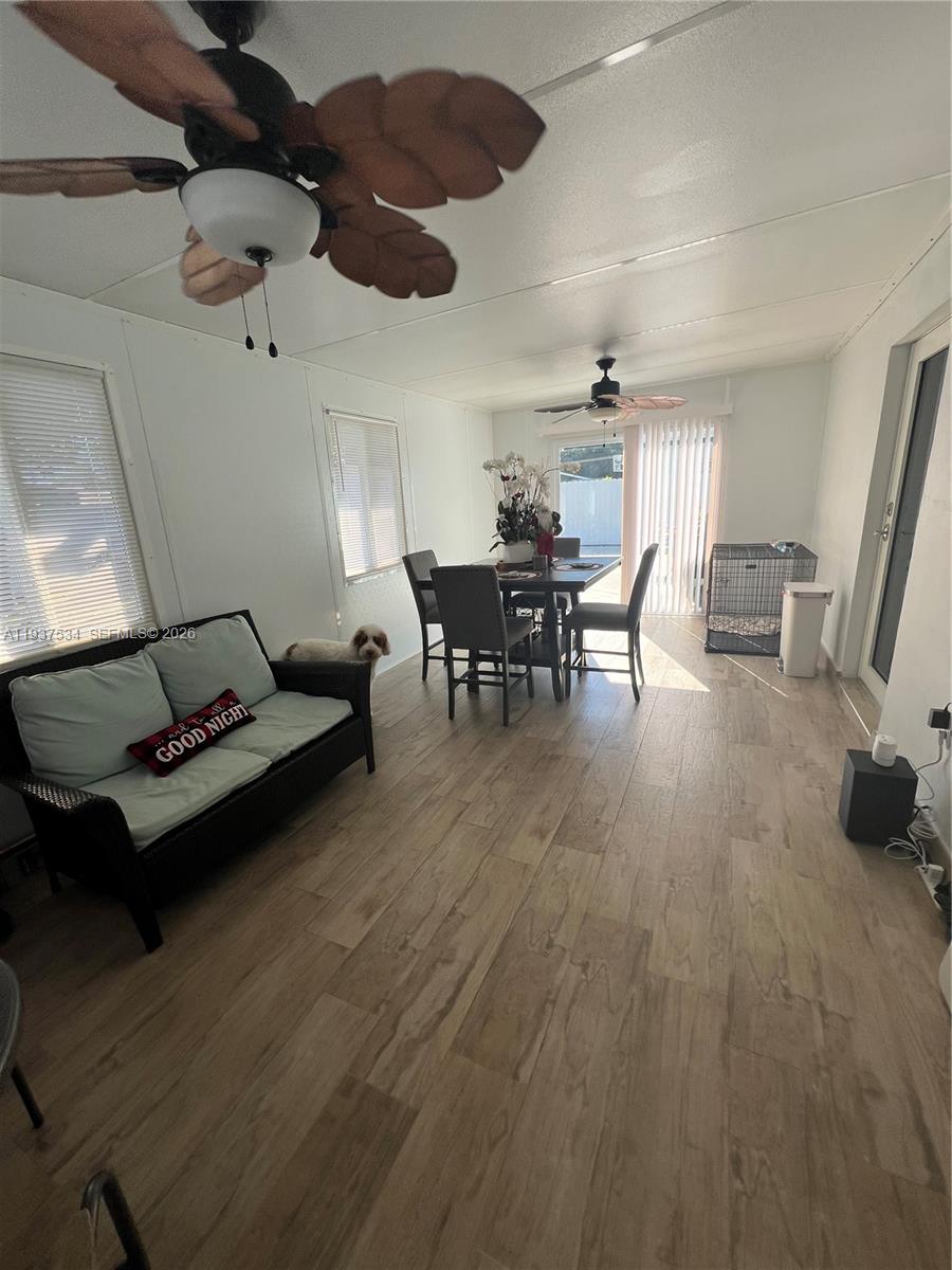 1461 East 9th Court Hialeah, FL 33010 - Photo 20 of 31 a living room with furniture and a wooden floor