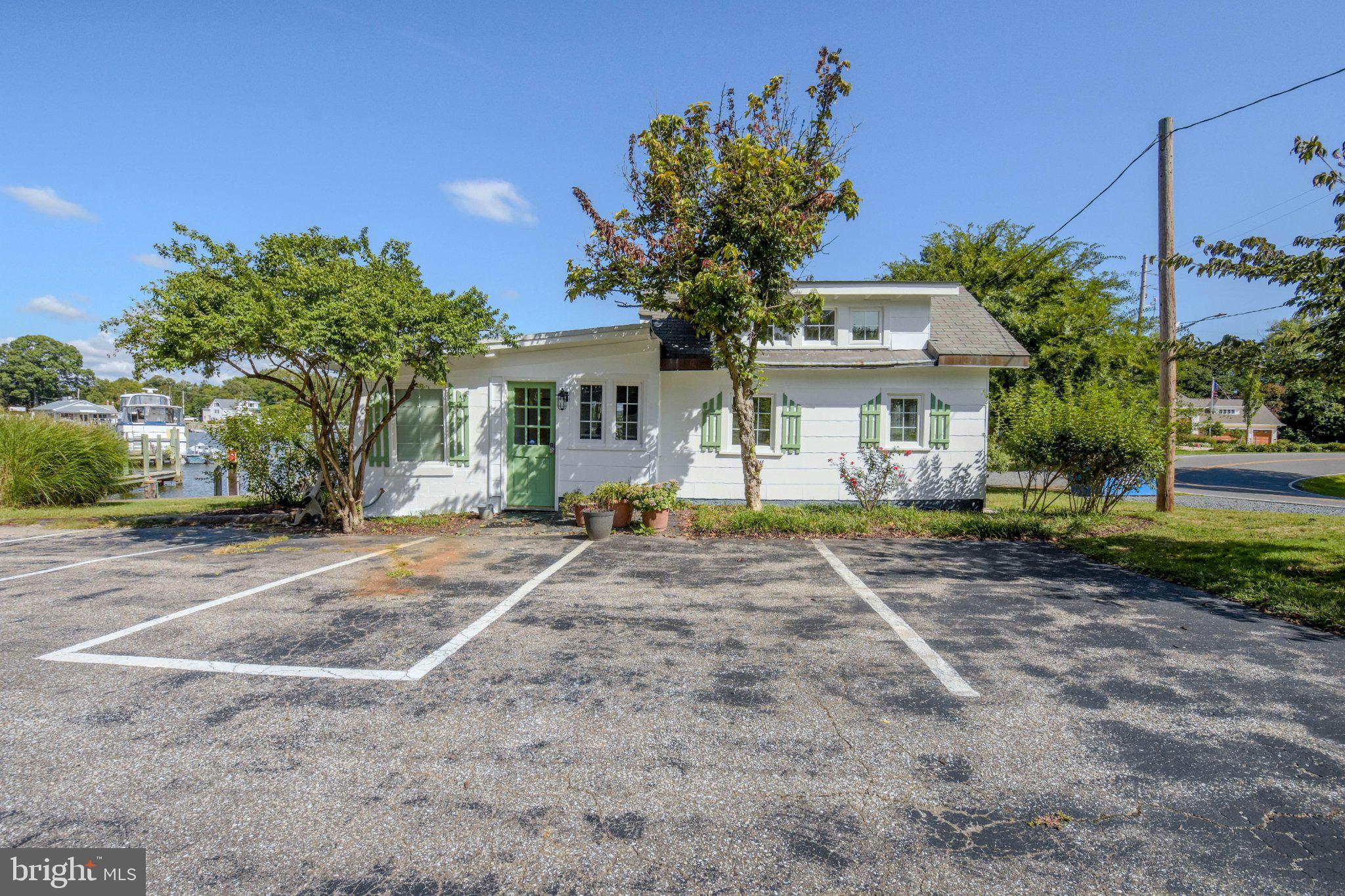 6062 Drum Point Road Deale, MD 20751 - Photo 16 of 17 Charming cottage with lush greenery.