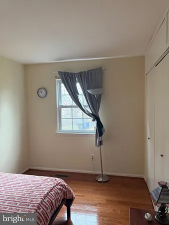 a bedroom with a bed and a television