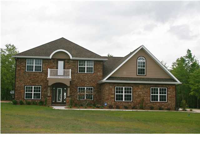 1 Wayne Rogers Road Crestview, FL 32539 - Photo 1 of 1 a front view of a house with a garden