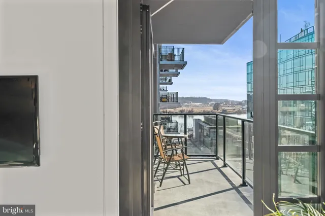 a view of a balcony with city view