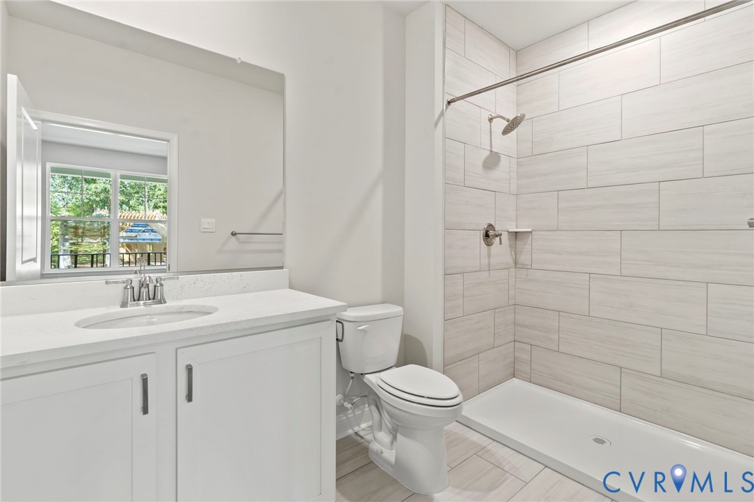 16801 Barmer Road Chesterfield, VA 23832 - Photo 15 of 20 a bathroom with a sink a toilet and shower