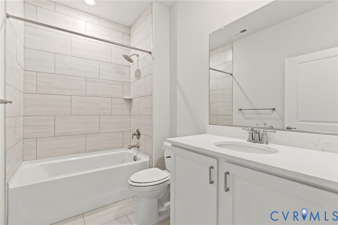 16801 Barmer Road Chesterfield, VA 23832 - Photo 16 of 20 a bathroom with a sink a toilet and shower