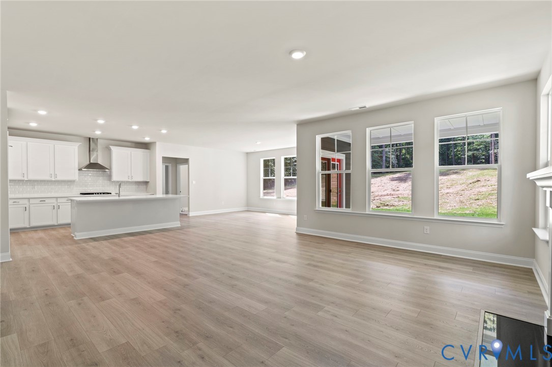 16801 Barmer Road Chesterfield, VA 23832 - Photo 5 of 20 a view of an empty room with window and wooden floor