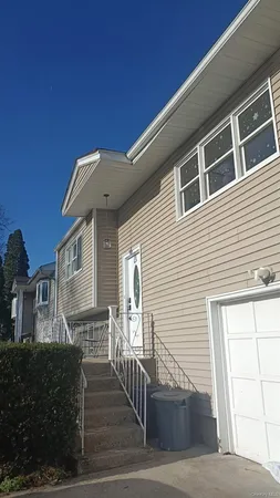 a front view of a house with wooden fence