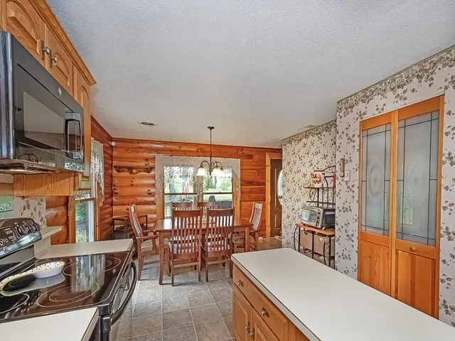 a room with furniture a rug and a window