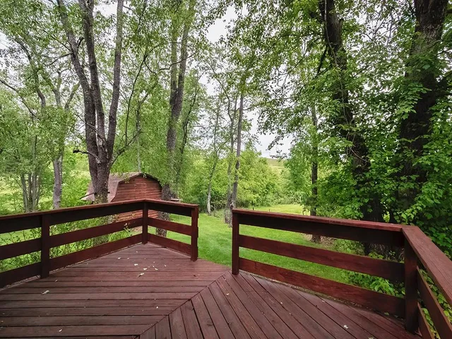 a view of outdoor space with deck and yard