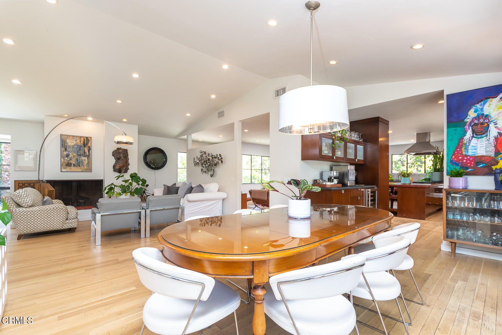 1471 Normandy Drive Pasadena, CA 91103 - Photo 17 of 41 a dining room with wooden floor and glass table