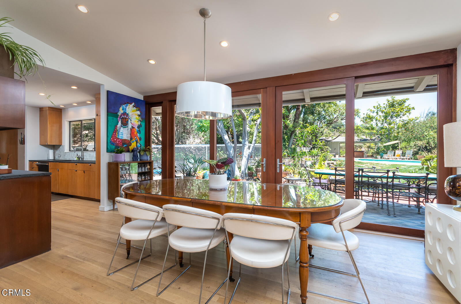 1471 Normandy Drive Pasadena, CA 91103 - Photo 20 of 41 a dining room with furniture a chandelier and wooden floor