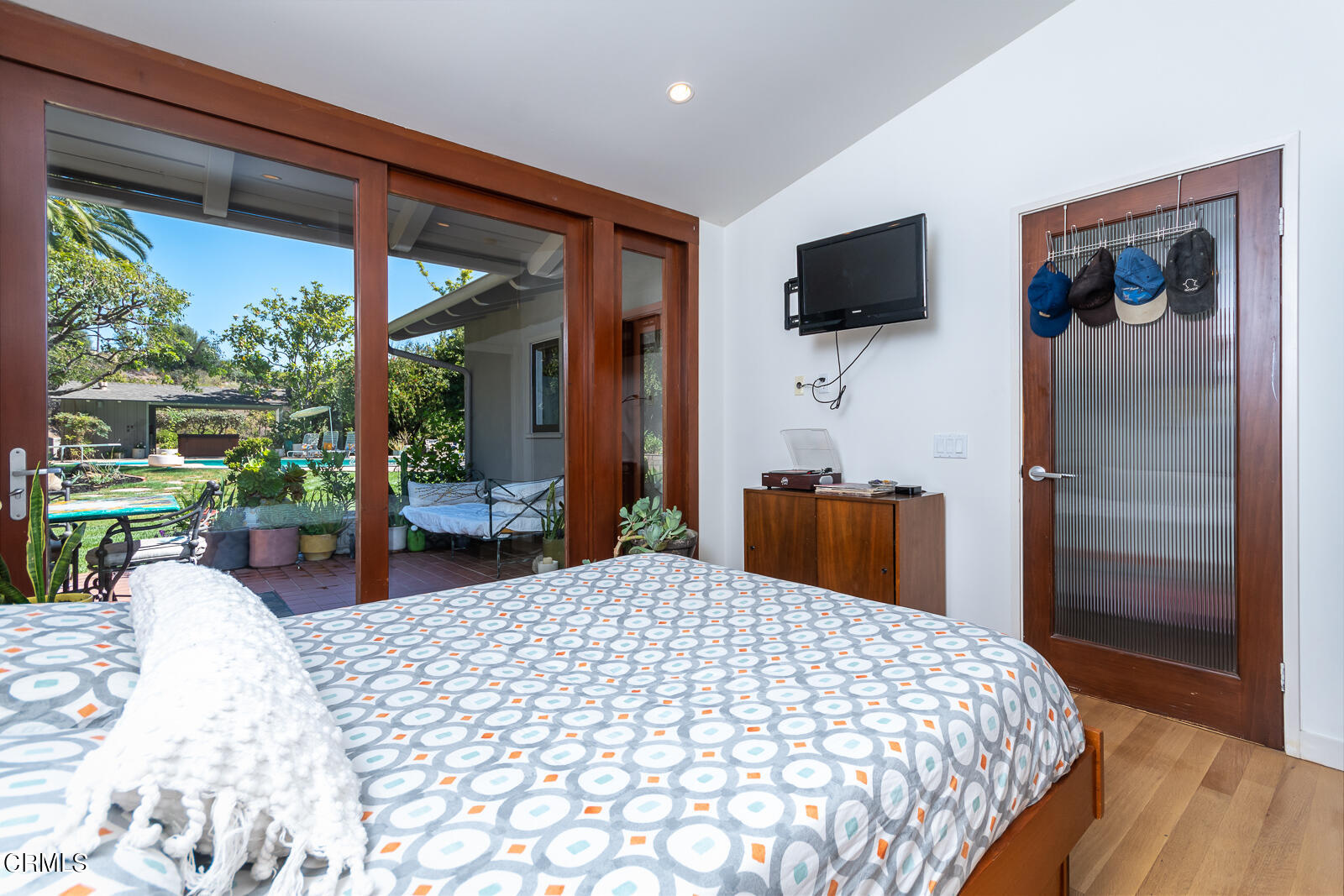 1471 Normandy Drive Pasadena, CA 91103 - Photo 26 of 41 a bedroom with a bed and a flat tv screen next to a large window