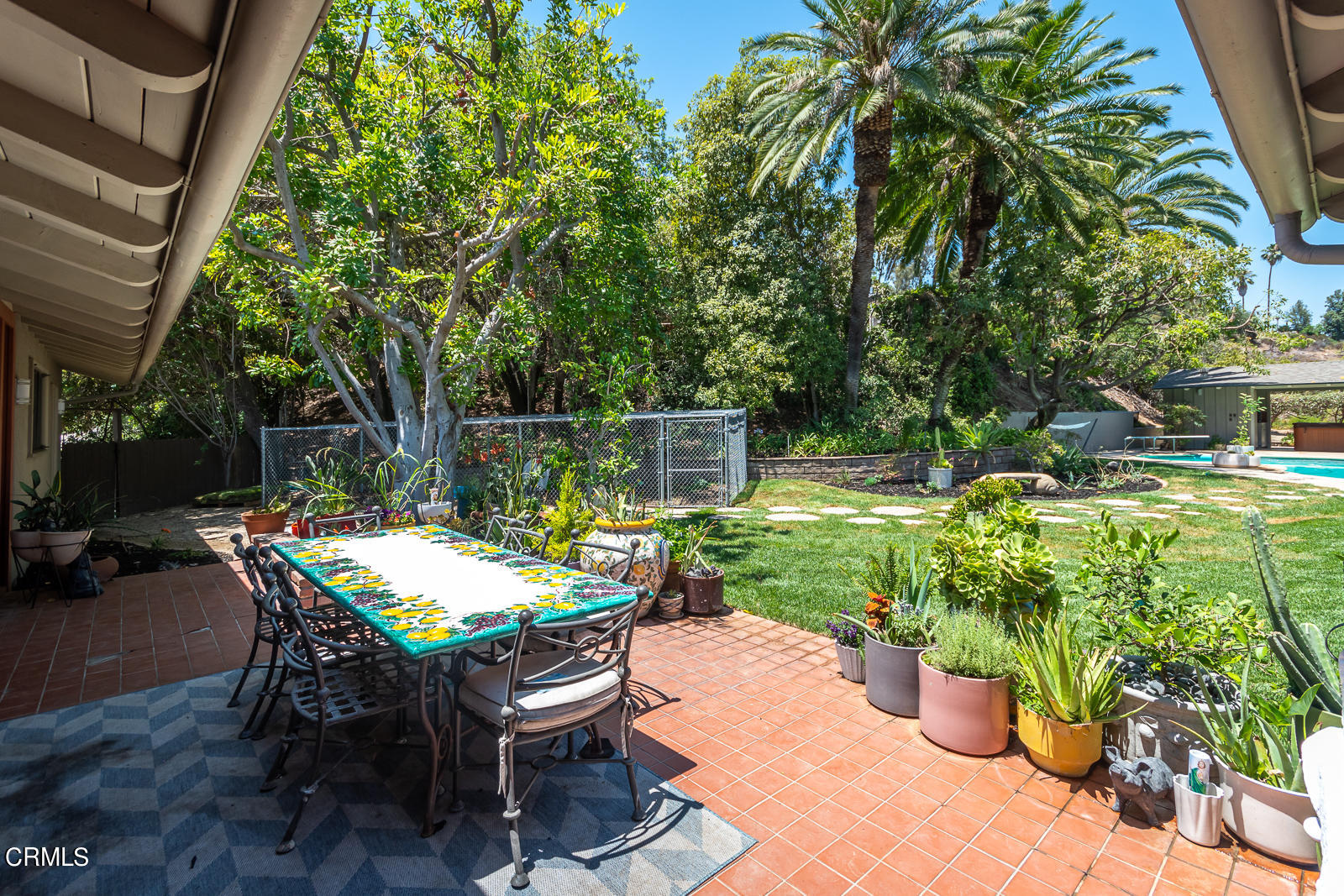 1471 Normandy Drive Pasadena, CA 91103 - Photo 31 of 41 a view of a chairs and table in backyard