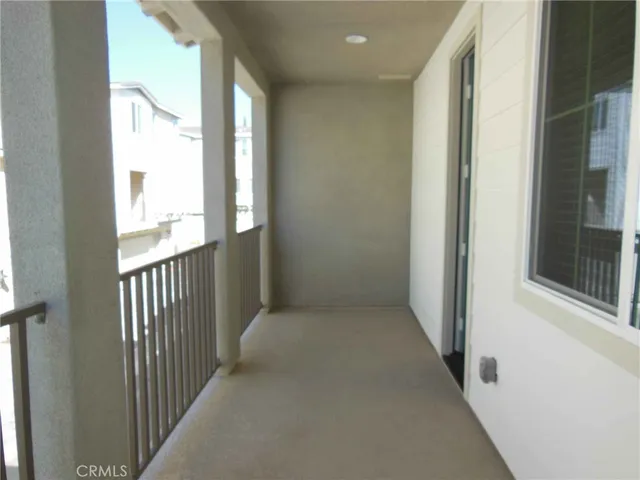 a view of a hallway with windows