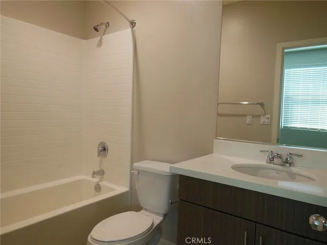 a bathroom with a sink toilet and bathtub