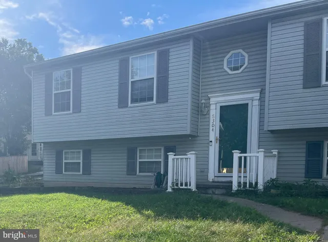 a brick house that is sitting in front of a house