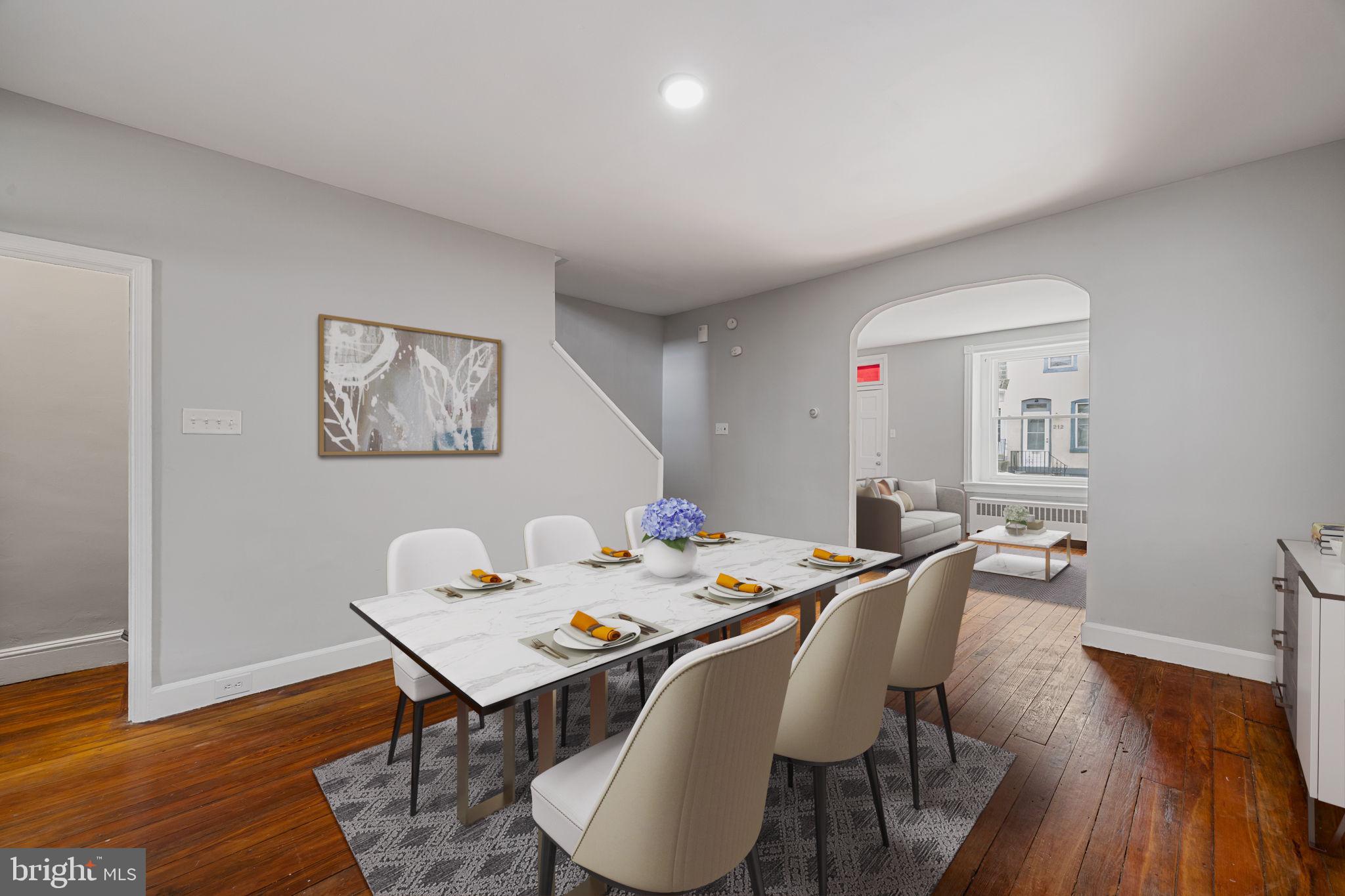 213 Dawson Street Philadelphia, PA 19128 - Photo 5 of 26 Digitally Staged dining space with warm tones.