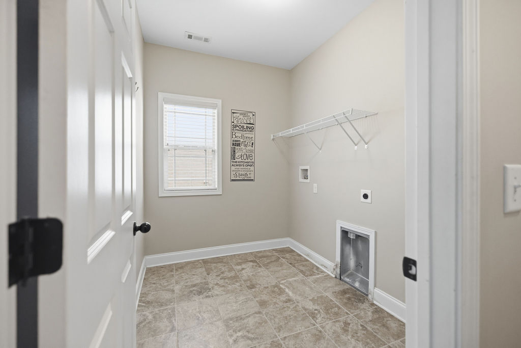 214 Friend Street Anderson, SC 29621 - Photo 14 of 40 Functional laundry space offering convenience and practicality for daily chores.