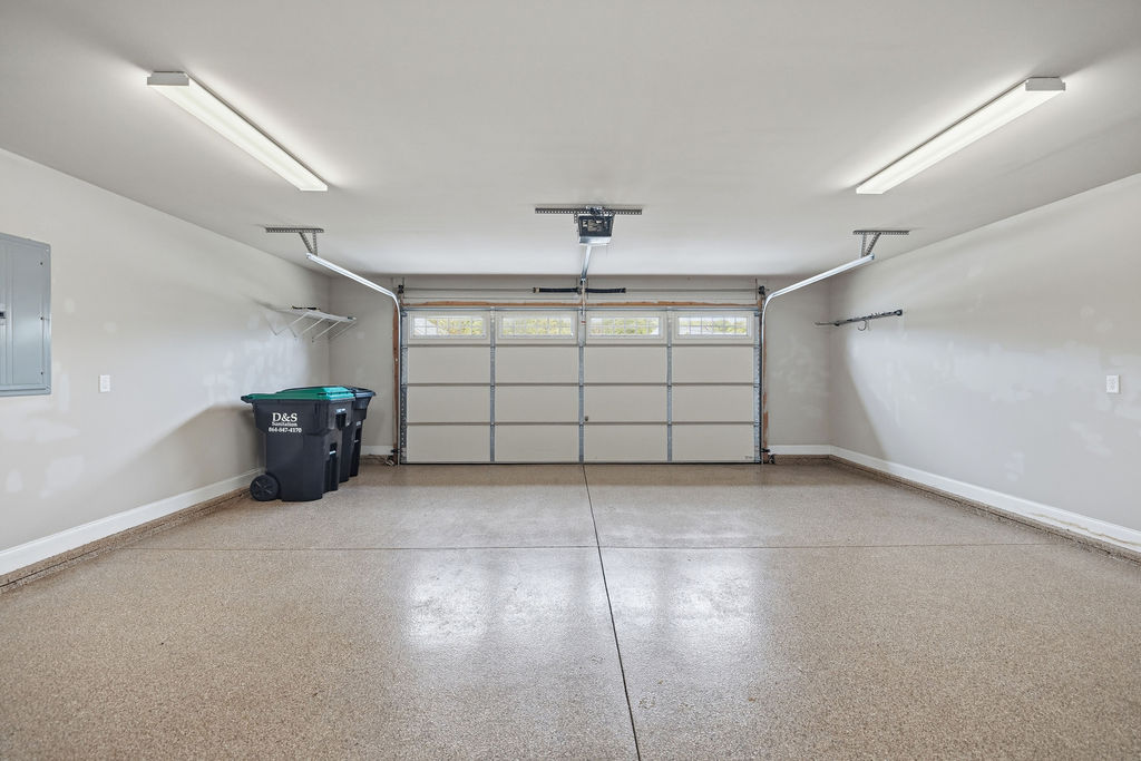 214 Friend Street Anderson, SC 29621 - Photo 15 of 40 This spacious garage offers ample parking and storage with a durable epoxy floor.