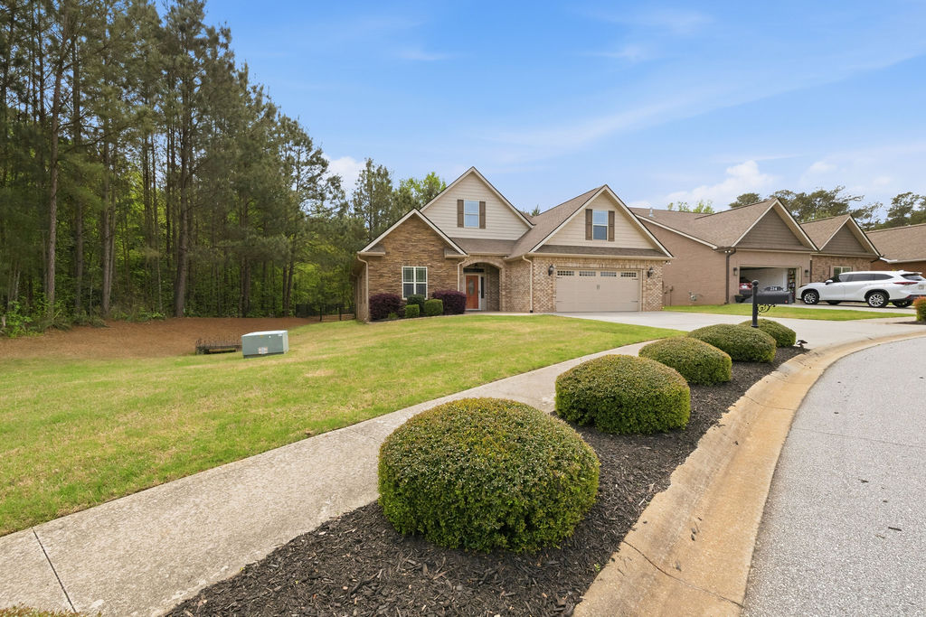214 Friend Street Anderson, SC 29621 - Photo 2 of 40 This charming home features a classic brick exterior and a well-maintained front yard.