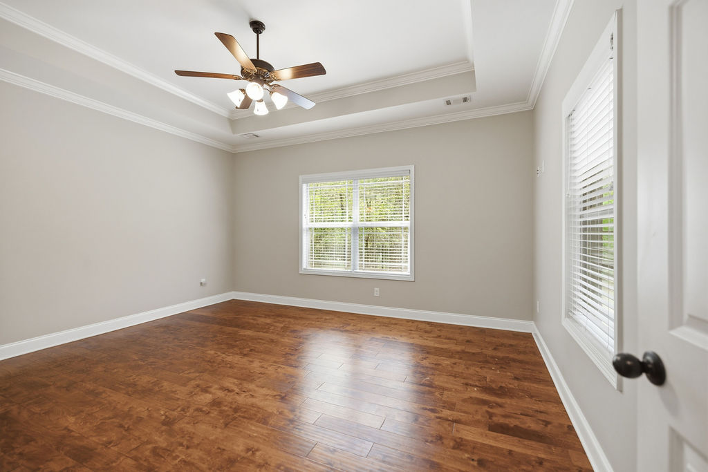 214 Friend Street Anderson, SC 29621 - Photo 25 of 40 This spacious room features rich hardwood flooring and a stylish tray ceiling.