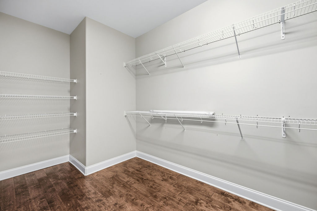 214 Friend Street Anderson, SC 29621 - Photo 29 of 40 This spacious walk-in closet offers ample storage with versatile shelving.