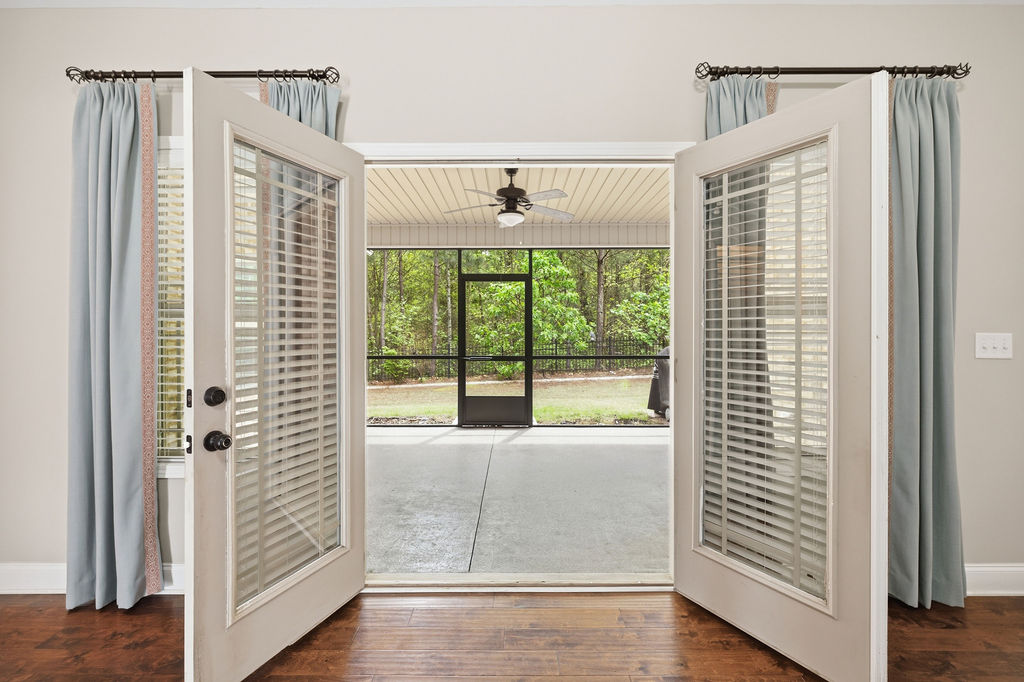 214 Friend Street Anderson, SC 29621 - Photo 32 of 40 Step outside to your private screened porch, perfect for enjoying the serene outdoor living space.
